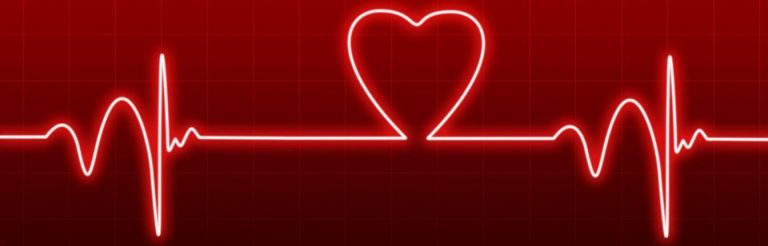 An EKG graphic showing heart beats. The line makes a heart shape in the middle.