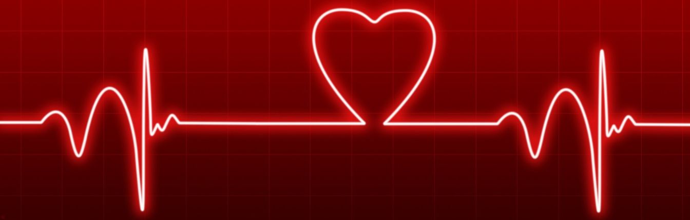 An EKG graphic showing heart beats. The line makes a heart shape in the middle.